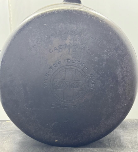 Griswold Tite-Top Dutch Oven bottom number 13, large block logo EPU. Sold for $1,700.